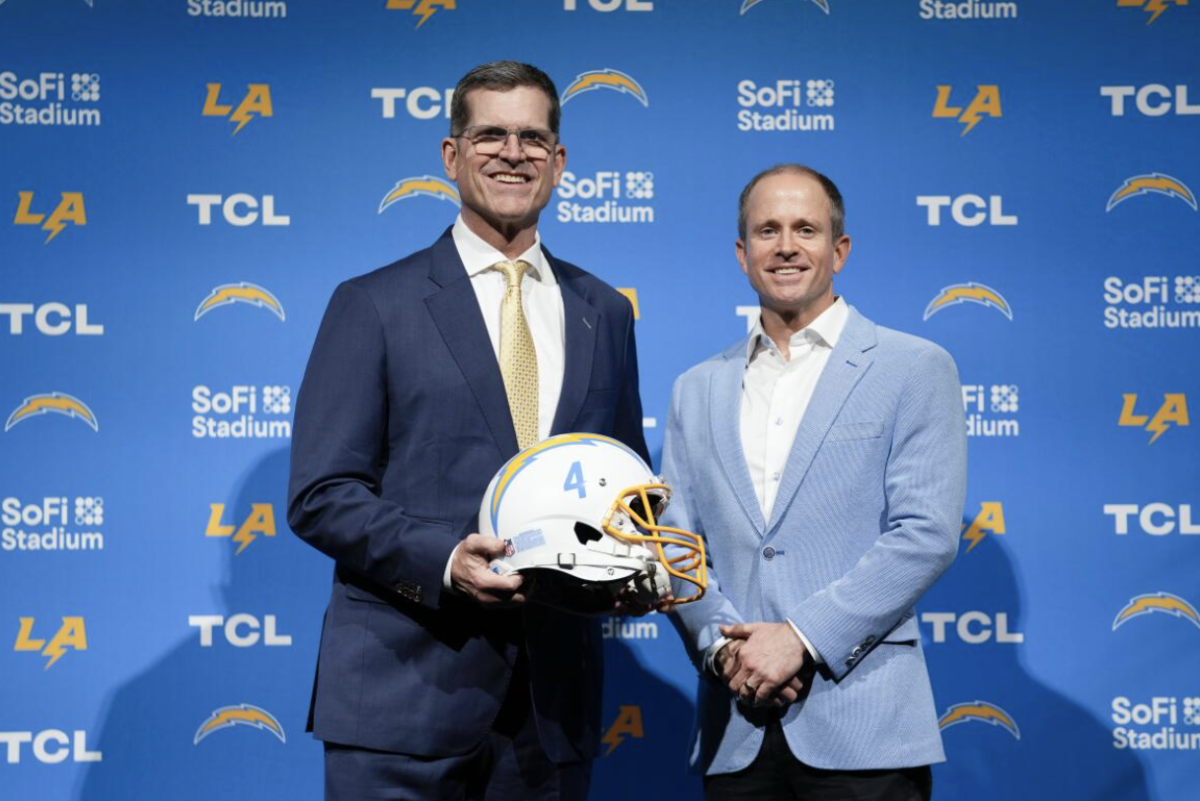 Jim Harbaugh (Left) with President of Business Operations John Spanos (Right) during a press conference introducing him as the new Head Coach of the Los Angeles Chargers.
